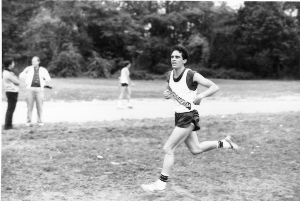 Carl Competing in College.  Curly Hair.  Favorite Shoes.  Striped Tube socks!